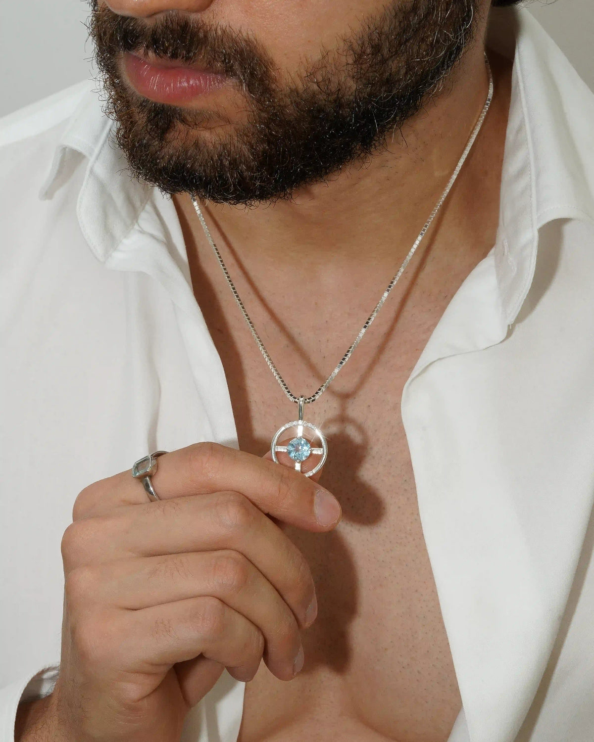 Arc Pendant – Sky Blue Topaz + Diamonds – worn by a model
